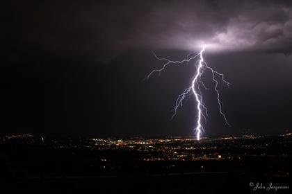 A lightning bolt strikes Boulder, Colo., as seen from the National Center for Atmospheric Research mesa west of town. Photo courtesy of John Jorgensen CU-Boulder researchers use climate model to better understand electricity in the air